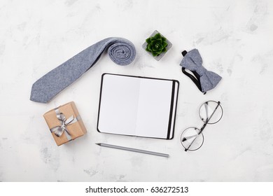 Happy Fathers Day Mockup With Notebook, Gift, Glasses, Necktie And Bowtie On White Background Top View In Flat Lay Style