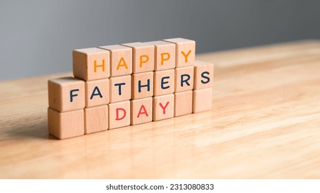 HAPPY FATHERS DAY word stacked wooden cube blocks on wood table background with copy space. Childhood and education concept. World fathers day celebration lettering banner and advertising poster theme - Powered by Shutterstock