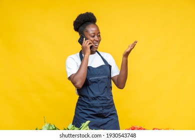 Happy Female African Chef Making A Phone Call