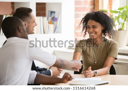 Happy female african vacancy candidate shaking hand of hr recruiting manager congratulating hired applicant with handshake, successful interview winner make good first impression got new job concept