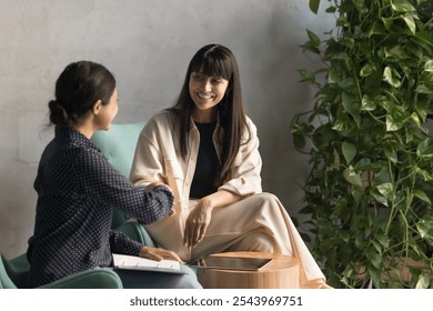 Happy female business colleagues negotiating in office lounge, giving handshakes, expressing respect, recognition for good job. Intern thanking mentor, coach, teacher for training, help, consultation - Powered by Shutterstock