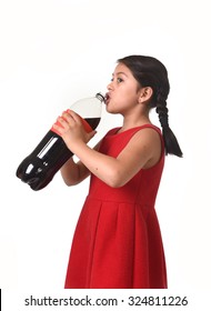 Happy Female Child Holding Big Cola Soda Bottle Drinking Isolated On White Background In Sugar Drink Abuse And Addiction And Sweet Nutrition Excess