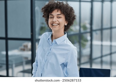 Happy female designer standing in office - Powered by Shutterstock