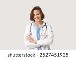 Happy female doctor with stethoscope on white background