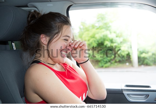happy female driver driving a
car