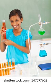 Happy Female Elementary School Pupil In Science Class