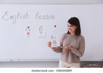 Happy Female English Teacher Giving Lesson Indoors. Early Childhood Education