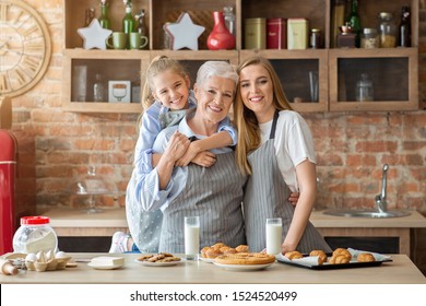 Happy Female Family Taking Photo While Baking At Kitchen, Little Girl And Her Mom Hugging Cheerful Granny, Copy Space