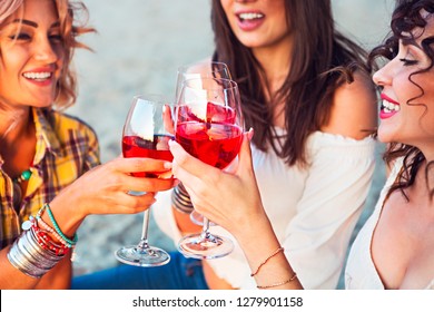 Happy Female Friends With Glass Of Rose Wine On Summer Beach Picnic 