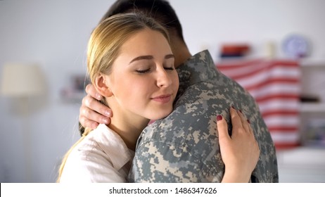 Happy Female Hugging Soldier Boyfriend Coming Home After Military Service, Love