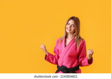 Happy Female Karate Instructor On Color Background