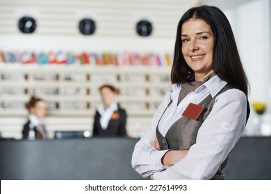 Happy Female Manager Worker Standing At Hotel