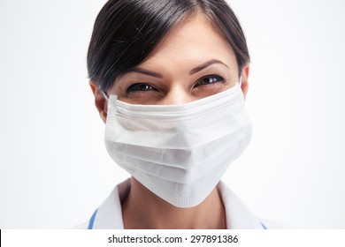 Happy Female Medical Doctor In Mask Looking At Camera Isolated On A White Background