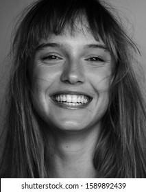 Happy Female Model Posing Laughing Black And White Portrait. Beautiful Laughing Woman Portrait. Pretty Girl Laughing Portrait. 