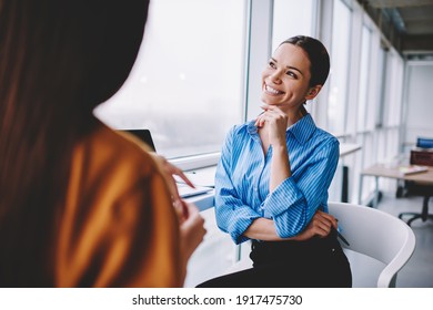 Happy female partners communicating about project planning productive collaboration, cheerful businesswoman laughing and smiling during friendly conversation with colleague in office interior - Shutterstock ID 1917475730