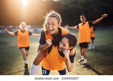 Happy female players celebrating a goal during soccer match at the stadium, - Powered by Shutterstock