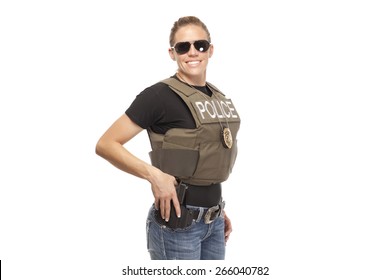 Happy Female Police Officer Standing Against White Background