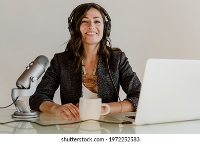 Happy Female Radio Host Broadcasting Live In A Studio