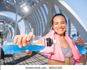 Happy Female Runner With Energetic Drinks For Hydration. Recovery Concept