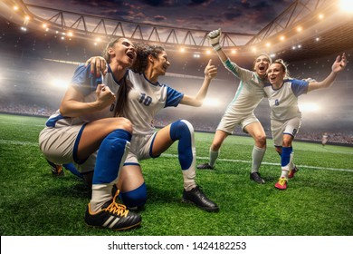 Happy Female Soccer players on a professional soccer stadium. Girls Team emotionally celebrates victory - Shutterstock ID 1424182253