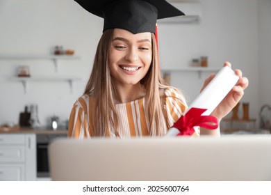 Happy female student on her graduation day at home. Concept of studying online - Shutterstock ID 2025600764