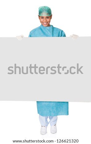 Happy Female Surgeon Holding Placard. Isolated On White