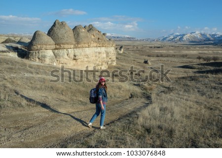 Happy female tourist to travel in wild trip hiking during vacation.Travel concept.