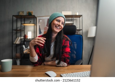 Happy Female Video Editor Works Indoors In Creative Office Studio.