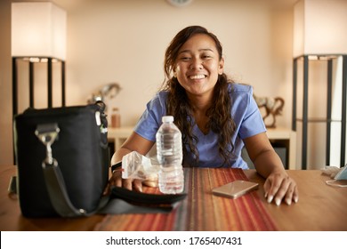 Happy Filipina Nurse At Home Packing Lunch Portrait