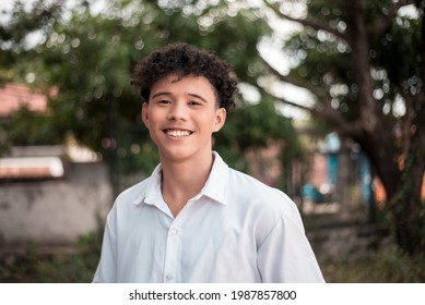 A happy Filipino-African college student. Handsome biracial young man with a great smile outdoors. - Powered by Shutterstock