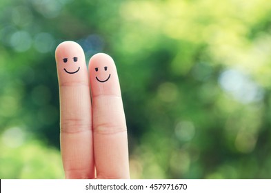 Happy Finger Smileys Faces On Hand With Bokeh Nature Background, Outdoor.