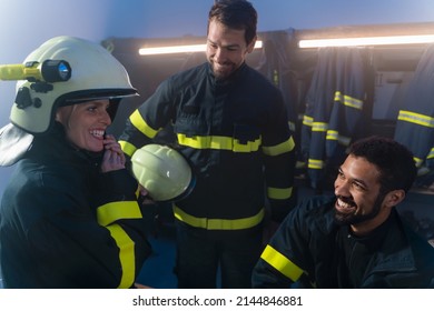 Happy Firefighters Men And Woman Talking After Action Indoors In Fire Station