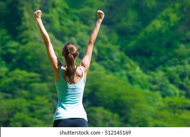 Happy Fit Girl With Her Arms In The Air Celebrating. Healthy And Active Lifestyle Concept. 