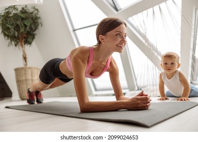 Happy Fit Woman Doing Plank Exercise At Home