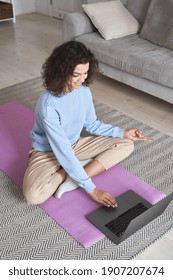 Happy Fit Young Woman Using Laptop Computer Watching Online Yoga Lesson, Fitness Video Class, Learning Virtual Meditation Training Tutorial, Doing Exercise, Feels Stress Free, Peace Of Mind At Home.