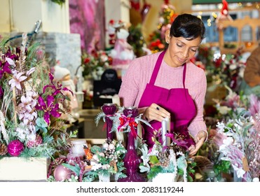 Happy Flower Shop Owner Holding Christmas Composition