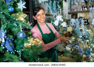 Happy Flower Shop Owner Holding Christmas Composition