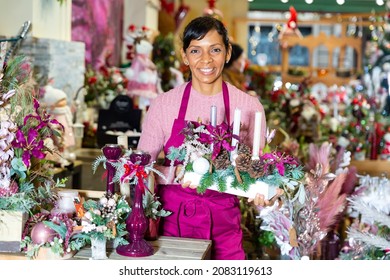 Happy Flower Shop Owner Holding Christmas Composition