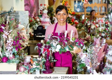 Happy Flower Shop Owner Holding Christmas Composition