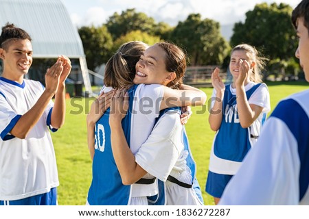 Similar – Image, Stock Photo Teenage girl playing with her younger sister in a home playground in a backyard. Happy smiling sisters having fun on a swing together on summer day. Real people, authentic situations