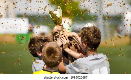 Happy Football Team Rising Golden Trophy on Confetti Celebration Moment. Happy Kids Winning Soccer Touranment for School Sports Teams