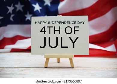 Happy Forth Of July Independence Day Text Messege  With USA Flag On Wooden Background