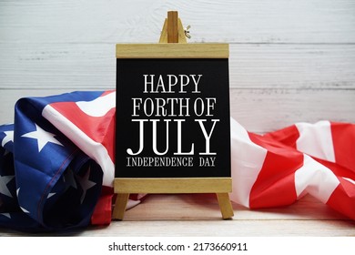 Happy Forth Of July Independence Day Text Messege  With USA Flag On Wooden Background