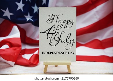 Happy Forth Of July Independence Day Text Messege  With USA Flag On Wooden Background