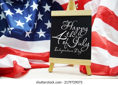 Happy Forth Of July Independence Day Text Messege  With USA Flag On Wooden Background