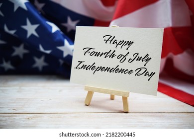 Happy Forth Of July Independence Day Text Messege  With USA Flag On Wooden Background