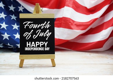 Happy Forth Of July Independence Day Text Messege  With USA Flag On Wooden Background