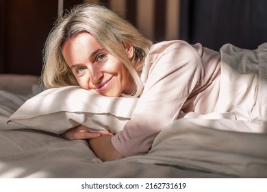 Happy Fresh Mature Middle Aged Woman Sitting In Bed Waking Up Alone Happy Concept, Smiling Lady Awake After Healthy Sleep Sitting In Cozy Comfortable Bedroom Interior Enjoy Good Morning