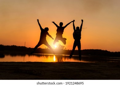 Happy friend jumping at tropical sunset beach background. Copy space of friendship freedom vacation and travel holiday teamwork. - Powered by Shutterstock