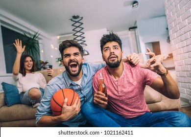 Happy Friends Or Basketball Fans Watching Basketball Game On Tv And Celebrating Victory At Home.Friendship, Sports And Entertainment Concept.